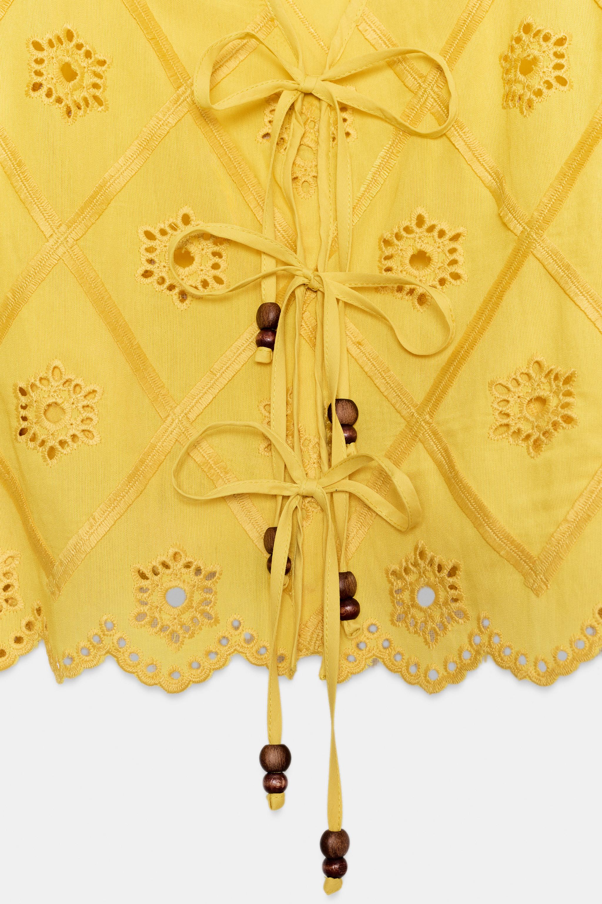 EMBROIDERED EYELET TOP